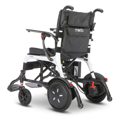 Modo Breeze Ultralightweight Folding Electric Wheelchair with a black padded seat and backrest, shown from a three-quarters rear angle on a white studio background.