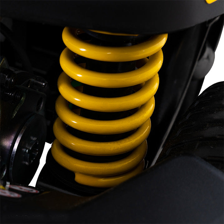 Close-up of a yellow shock absorber on a Pride Go-Go Endurance AL+