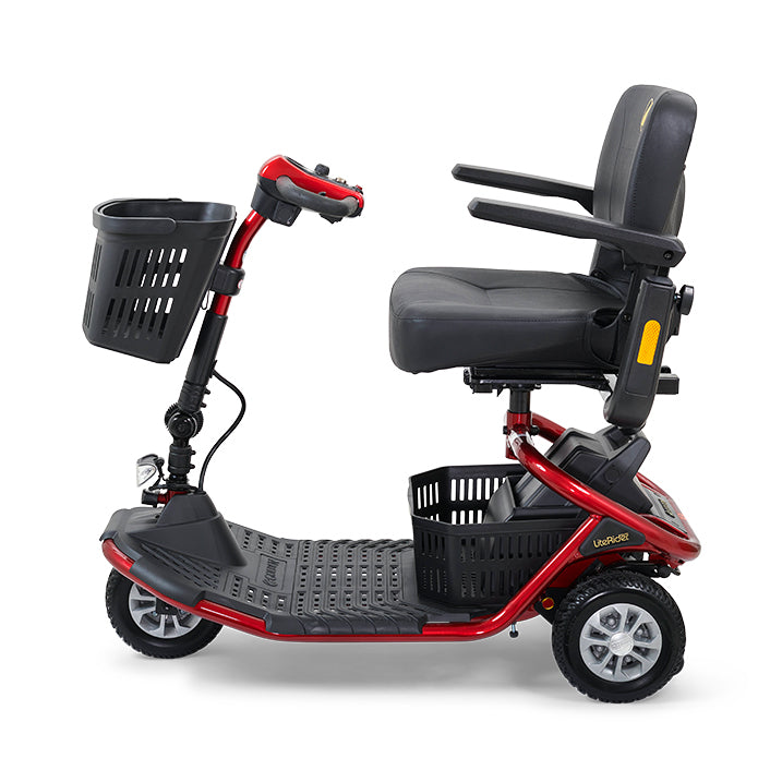 Red and black mobility scooter with a basket on a white background