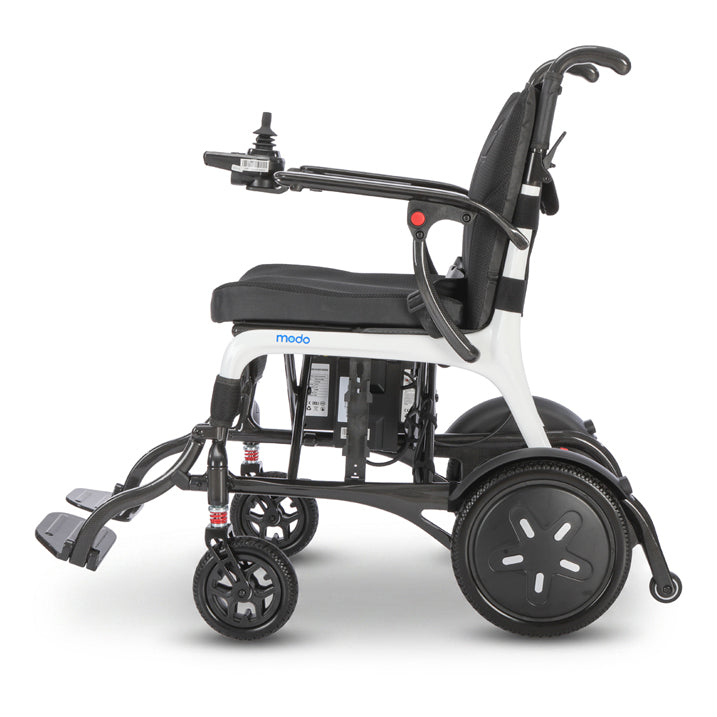 A white and black electric motorized wheelchair shown from a side profile view against a clean white background. The brand name 'modo' is visible on the side frame.