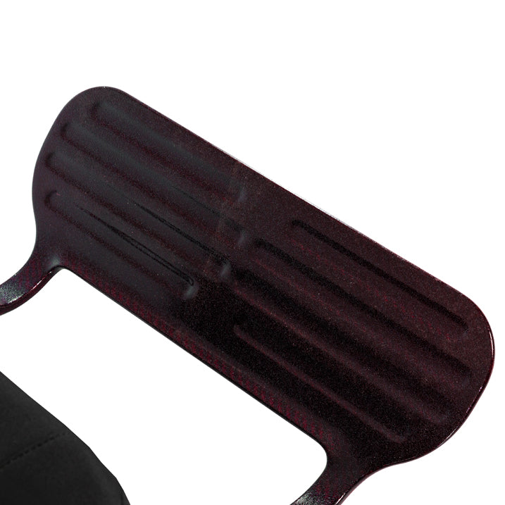 Black plastic tool with grooves on a white background