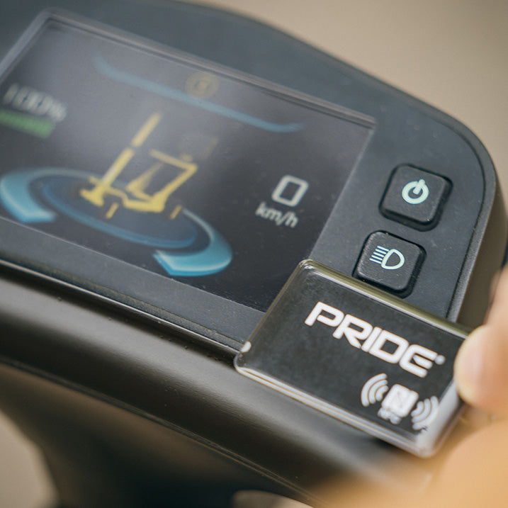 Close-up of a Pride scooter control panel with digital display and buttons.