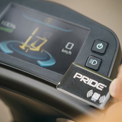 Close-up of a Pride scooter control panel with digital display and buttons.
