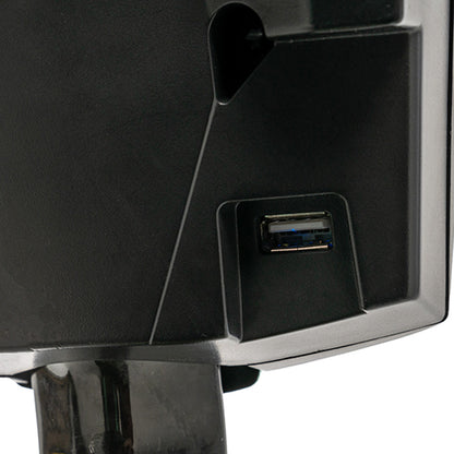 Close-up of a black electronic device with a USB port on a white background