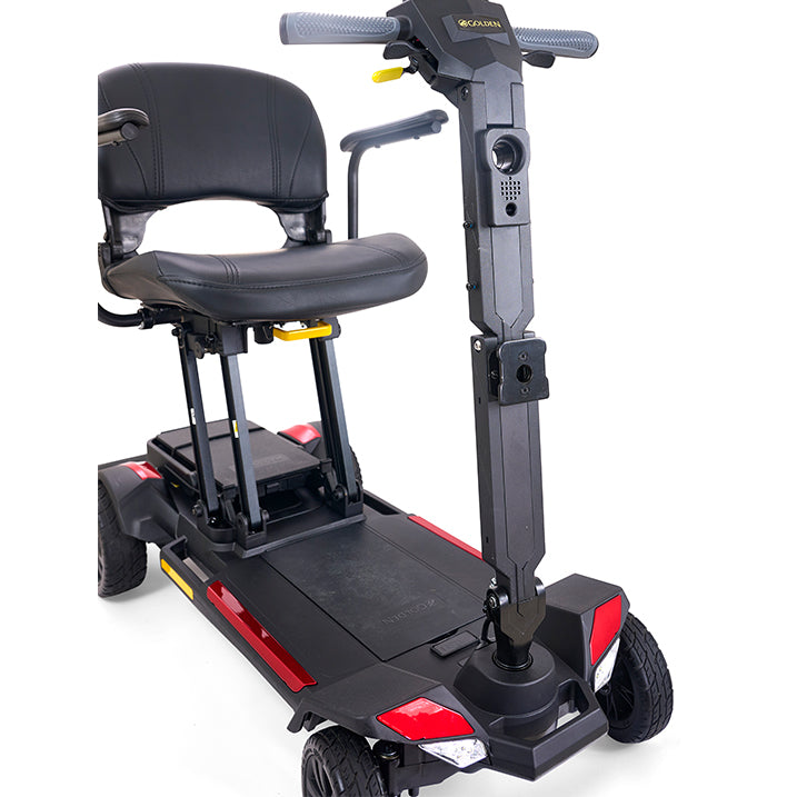 Black and gray mobility scooter with a seat on a white background