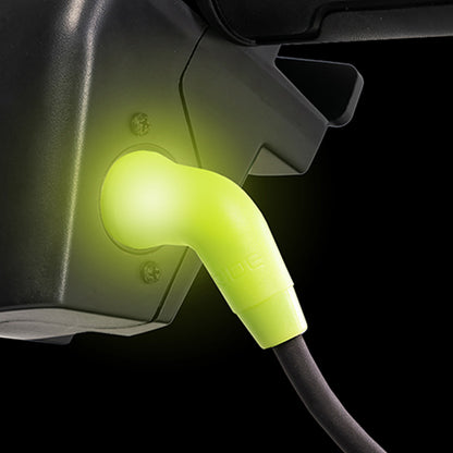 Close-up of a yellow charging cable connector on a black background