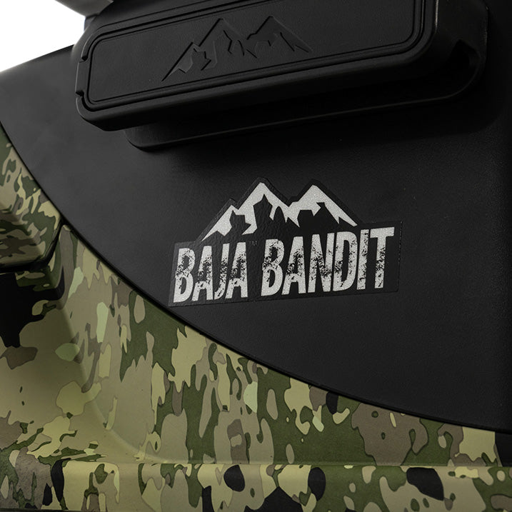 Close-up of a Baja Bandit logo on a camouflage and black background