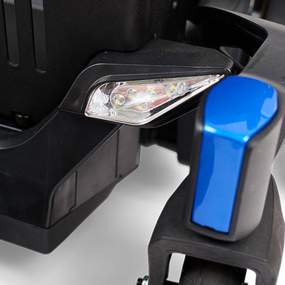 Close-up of a vehicle's front bumper with a blue light cover on a white background